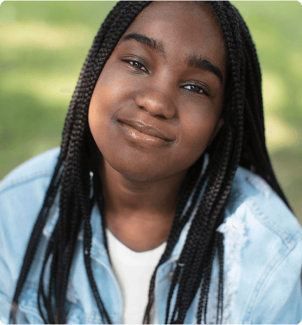Young girl with braided hair smiling