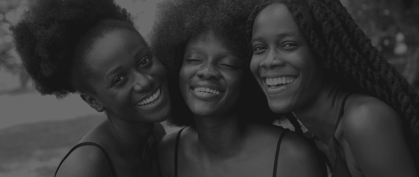 Three women looking towards the viewer